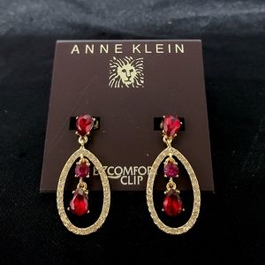Anne Klein gold with ruby stones. No ear piecing needed. A great gift for anyone